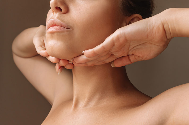 Plastic Surgery model with hands on her face