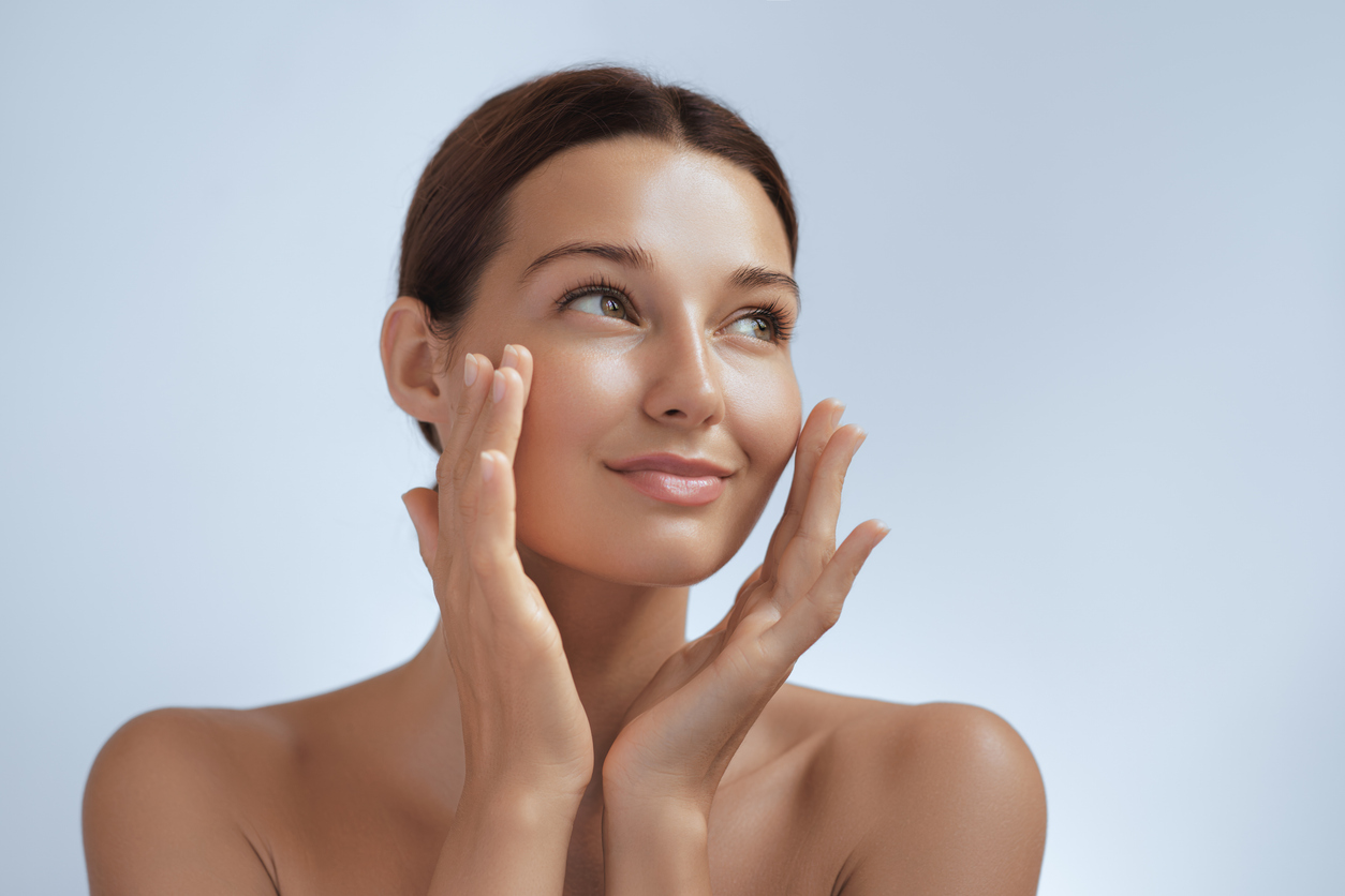 Plastic Surgery model with hands on her face
