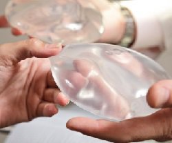 Beverly Hills plastic surgery breast implants in doctors hands