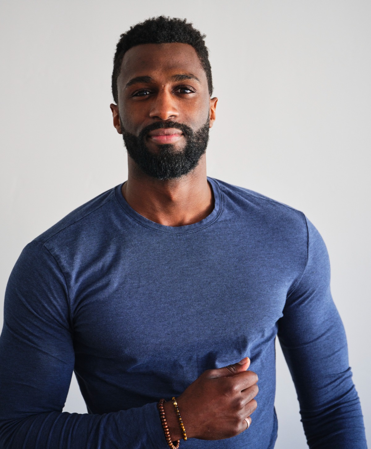 Beverly Hills Gynecomastia surgery model wearing a blue shirt